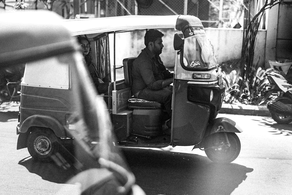 An auto-rickshaw driver — the everyday frontline work HumLogJobs is built around